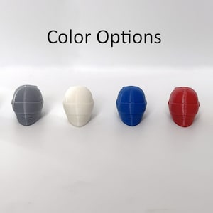 May include: Six miniature helmets in different colors: black, gray, white, blue, red, and yellow.  "Color Options" is written above the helmets.