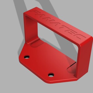 Puede incluir: Una manija de pl&aacute;stico roja con la palabra "FANATEC" en relieve en la parte superior. La manija est&aacute; unida a una base de pl&aacute;stico roja con dos agujeros para tornillos.
