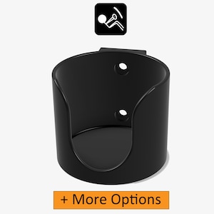 May include: Black plastic cup holder with two mounting holes. The cup holder is designed to hold a standard-sized cup or bottle.