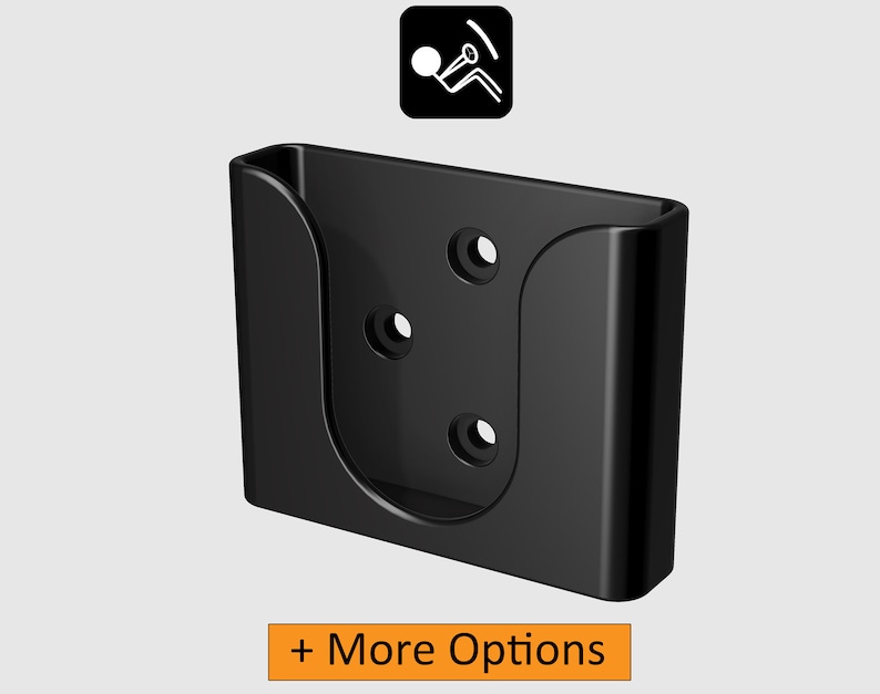 May include: Black plastic wall mount with three holes for screws. The mount has a curved opening for holding a device.