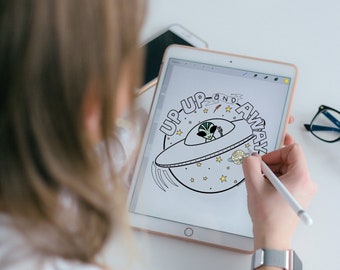 May include: A white tablet with a black and white illustration of a spaceship with the text "Up Up and Away" on it. The tablet is being held by a person.