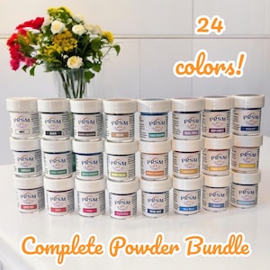 May include: A set of 24 small jars of powder pigment in various colors, labeled "PRSM" with the color name printed below. The jars are arranged in four rows of six jars each. The text "24 colors!" is printed in orange above the jars, and the text "Complete Powder Bundle" is printed in orange below the jars.