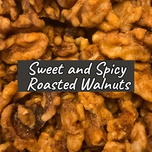 May include: Close-up of sweet and spicy roasted walnuts. The walnuts are golden brown and have a slightly crunchy texture.