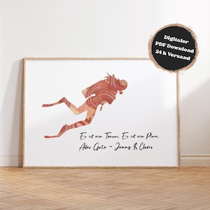 May include: A framed art print featuring a diver silhouette in shades of red and orange, set against a white background. The print includes German text and a circular graphic with text indicating a digital PDF download.