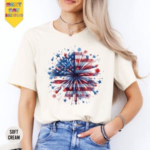 a woman wearing a t - shirt with an american flag design