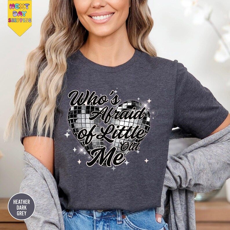 a woman wearing a t - shirt that says, who's afraid of little