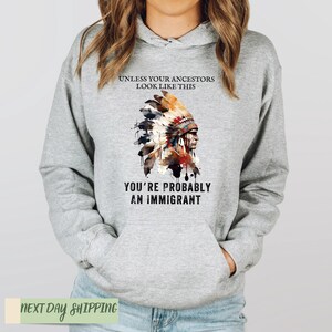 a woman wearing a hoodie that says unless you like this you're probably