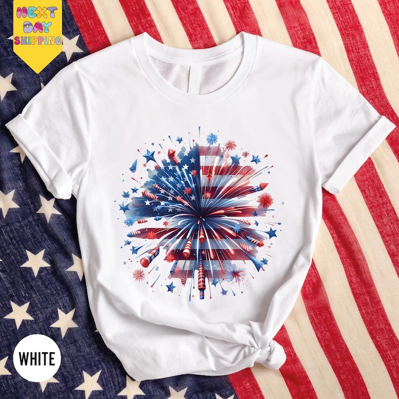 a white shirt with a red, white and blue fireworks on it