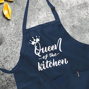 May include: A navy blue apron with a white crown and the text "Queen of the Kitchen".