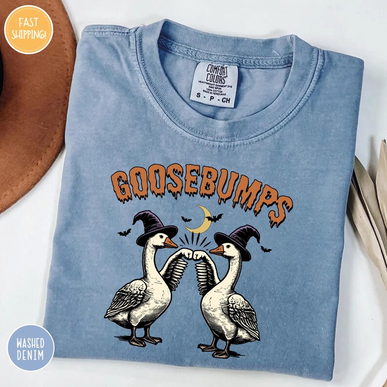 goosebumps t - shirt on a table with a hat