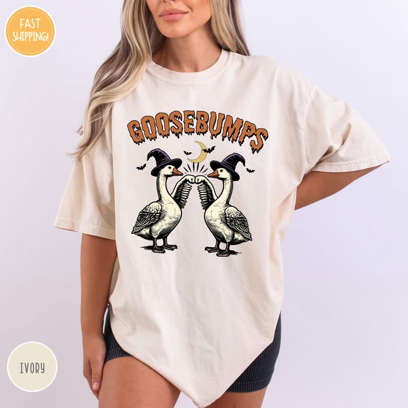 a woman wearing a t - shirt with two geese on it