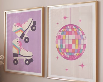 May include: Two framed prints with a retro theme. The print on the left features a pair of roller skates with rainbow stripes and pink accents on a purple background. The print on the right features a pink and yellow disco ball on a beige background.
