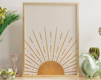 May include: A gold framed print with a minimalist sunburst design on a white background. The print is displayed on a wooden shelf with a vase of green orchids, a small hourglass, and a green ceramic horse figurine.