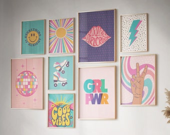 May include: A wall gallery featuring nine framed prints with various designs, including a smiley face, a disco ball, roller skates, a peace sign, and the text "Girl Power". The prints are arranged in a grid pattern on a white wall.