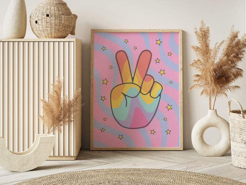 May include: A pink and blue psychedelic print with a rainbow peace sign. The print features yellow stars and wavy lines.