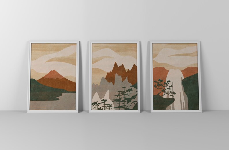 May include: Three framed prints with abstract mountain landscapes in shades of brown, green, and white. The prints are set against a white background.