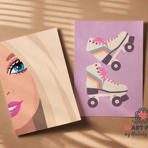 May include: Two art prints. One features a blonde woman's face with blue eyes and pink lips. The other shows two white roller skates with pink laces and rainbow stripes on a purple background. The art is signed by Nataly White.