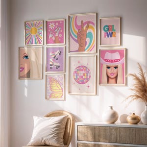 May include: A collection of framed art prints with a retro theme. The prints feature images of a sun, roller skates, a peace sign, a disco ball, a butterfly, and a portrait of a woman wearing a cowboy hat. The color palette includes pink, yellow, and blue.