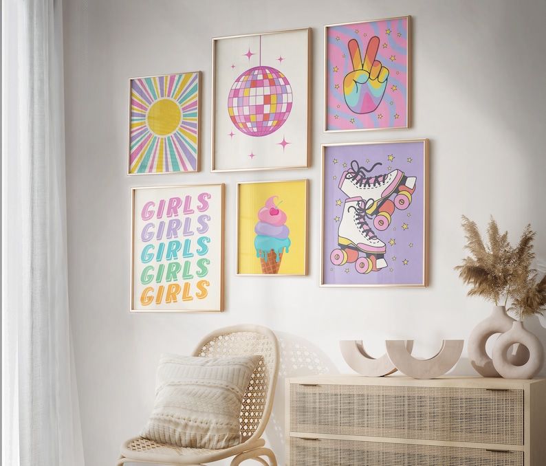 May include: A set of six colorful wall prints featuring a disco ball, a peace sign, roller skates, ice cream, and the word "Girls" repeated five times. The prints are framed in gold and have a retro aesthetic.