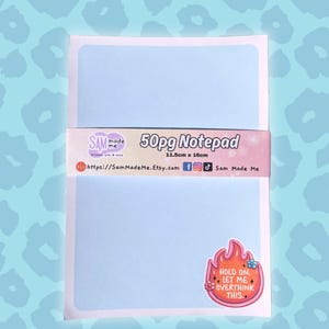 May include: A light blue notepad with a white border and a sticker that says "Hold on, let me overthink this." The notepad is 50 pages and measures 11.5cm by 16cm.