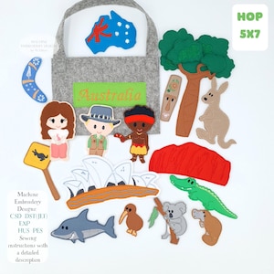 Puede incluir: Un conjunto de fieltro con diseños de bordado australianos, que incluyen un canguro, un cocodrilo y un koala. El conjunto presenta la palabra "Australia" y el texto "HOP 5X7".
