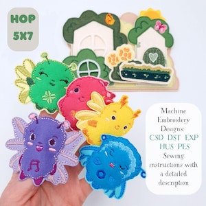 May include: A collection of colorful machine embroidery designs featuring whimsical creatures and a fairy house scene. The designs include a green, pink, yellow, purple, and blue creature. The image also includes the text "HOP 5X7" and "Machine Embroidery Designs".