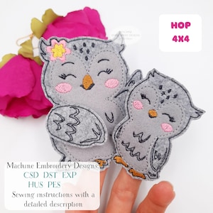 May include: Two gray felt owl appliqués with pink cheeks, orange beaks, and closed eyes. One owl has a small flower on its head. The text "HOP 4X4" is in a white box. The text "Machine Embroidery Designs" is also visible.