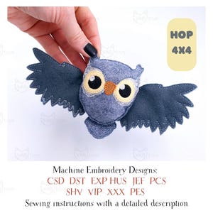May include: A blue-grey felt owl with open wings, yellow eyes, and an orange beak. The wings have a scalloped edge. The image includes text that says "HOP 4X4" and "Machine Embroidery Designs".