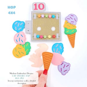 May include: A felt activity page featuring the number 10, two hand outlines, and colourful flower beads, accompanied by various felt ice cream scoops, cones, and hand shapes. Text includes HOP 4X4 and Machine Embroidery Designs: CSD DST(JEF) EXP HUS PES.
