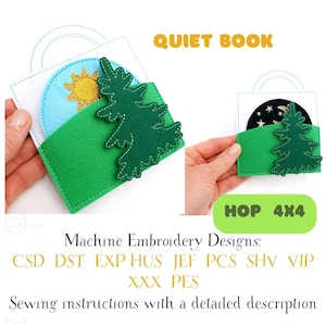 May include: A handmade quiet book with a green felt pocket and a tree applique. The book features a day and night scene with a sun and stars. The text "QUIET BOOK" is displayed in yellow.