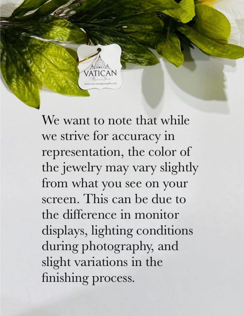 May include: A white tag with the word "VATICAN" and a logo is shown, along with text explaining that the jewelry color may vary slightly from the screen. Green leaves and yellow flowers are in the background.