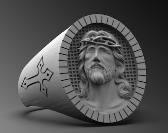 May include: A silver ring with a detailed image of Jesus wearing a crown of thorns. The ring has a cross design on the band.