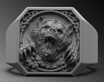 May include: A silver ring with an octagonal face featuring a detailed, three-dimensional sculpture of a bear's head roaring with its mouth open. The bear's head is surrounded by a circular design of leaves and vines.