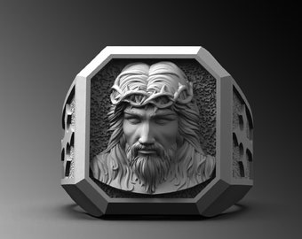 May include: A silver ring with a detailed, three-dimensional image of Jesus wearing a crown of thorns.