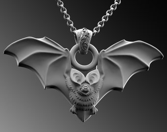 May include: A silver bat pendant necklace with a detailed bat design. The bat has large ears and wings spread out. The necklace has a silver chain.