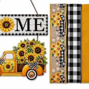 Op de afbeelding: Een hangend houten bord met het woord HOME met een zonnebloem in plaats van de letter O, gecombineerd met een gele vrachtwagen met zonnebloemen. Daarnaast liggen vier verticale linten met zonnebloem-, vrachtwagen- en zwart-wit ruitpatronen.