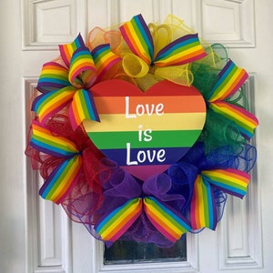 Love Is Love Rainbow Wreath - LGBTQ+ Pride Door Decor - Heart Sign with Mesh and Bows - Colorful Wreath for Porch, Office, or Gift