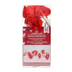 May include: Red LED heart-shaped string lights with 10 lights. The lights are 3 feet long and are for indoor use only.  LED STRING LIGHT CHAÎNE LUMIÈRES DEL