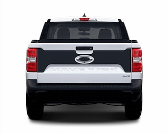 May include: A white Ford Maverick pickup truck with a black tailgate and the word "MAVERICK" in black lettering on the tailgate. The truck has a black rear bumper and a black rear window.