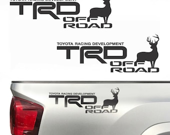 May include: Three black vinyl decals with the text "TOYOTA RACING DEVELOPMENT" and "TRD OFF ROAD" with a silhouette of a deer.