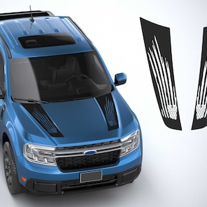 May include: A blue pickup truck with a black and white American flag hood decal and matching side decals. The truck has a sunroof and a black grille with the Ford logo.