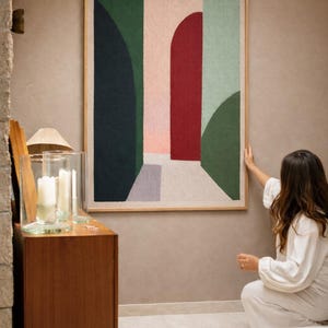 May include: A set of three ceramic mugs with a speckled, matte finish in cream, light grey, and dark grey. Each mug has a simple, minimalist design, suitable for coffee or tea.