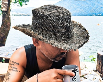 Hemp straw hat with frayed edge for man, flexible but resistant, foldable handmade hat for summer.