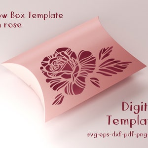 May include: A pink pillow box template with a cut-out rose design. The text "Pillow Box Template with rose" and "Digital Template" are displayed. File formats include svg, eps, dxf, pdf, png, and jpg.