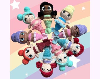 May include: A PDF crochet pattern for making a mermaid amigurumi doll. The pattern includes instructions for making a variety of different colored mermaids, each with a unique expression. The pattern is available for purchase from The Knit Knots.