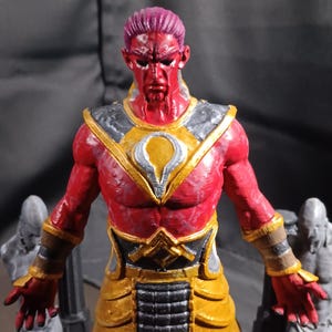 May include: A set of three ceramic mugs with a speckled, matte finish. The mugs are in shades of cream, light gray, and dark gray. Each mug has a simple, minimalist design and a rounded handle.