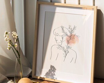 Könnte beinhalten: Ein gerahmter Druck eines Strichzeichnung einer Person mit einem floralen Design auf dem Rücken. Die Zeichnung ist auf weißem Hintergrund mit einem rosa Aquarell-Wasch. Der Rahmen ist aus hellem Holz.