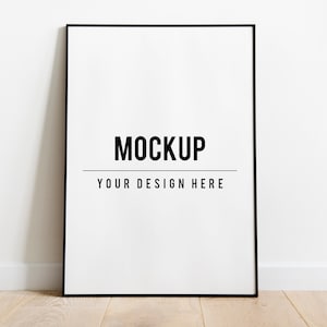 May include: A black frame mockup with the text "MOCKUP" and "YOUR DESIGN HERE" on a white background.