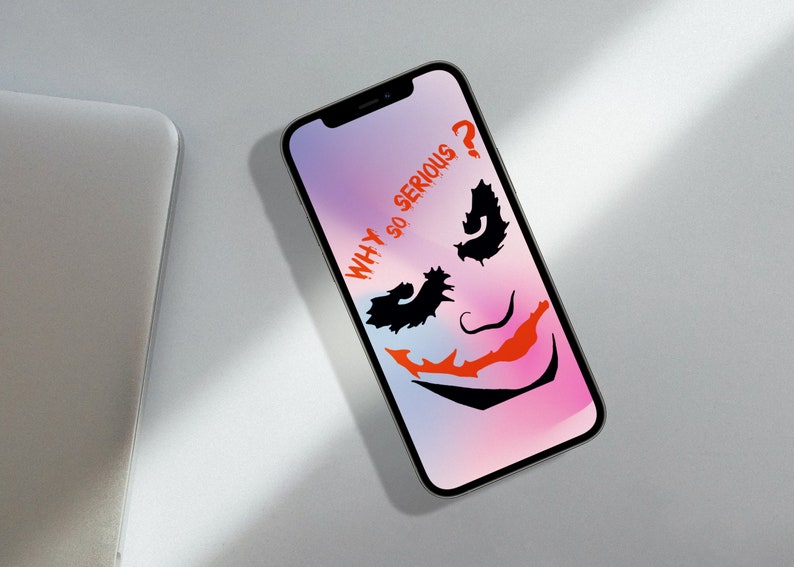 May include: A smartphone with a pink and blue gradient background. The screen displays a black and white silhouette of the Joker's face with the text "WHY SO SERIOUS?" in red.
