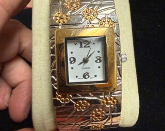 Women's silver and rosegold floral clasp/bangle hinge style watch WORKS